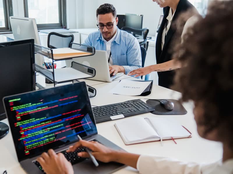 Two engineers reviewing code together